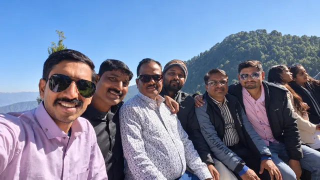 Friends taking a photograph in the hills