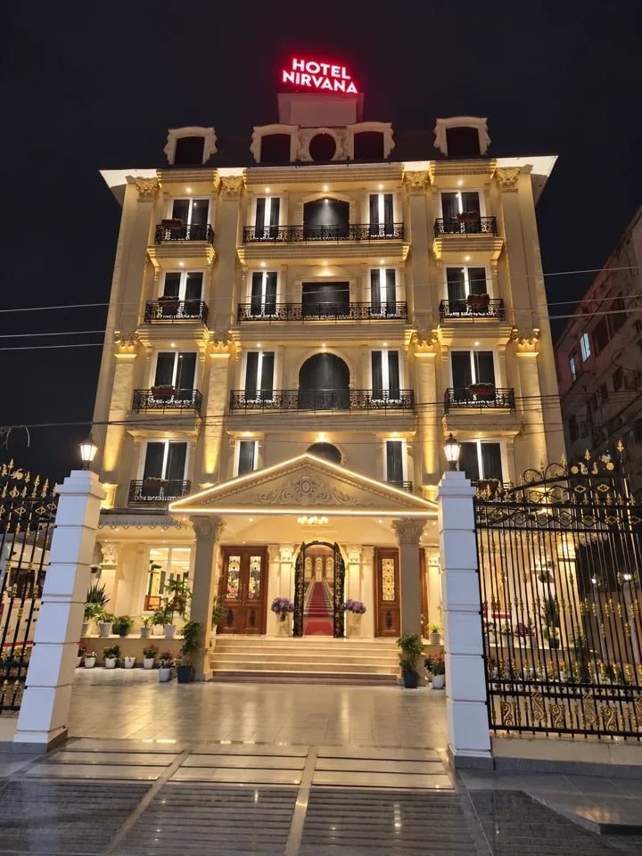 An illuminated hotel exterior at night