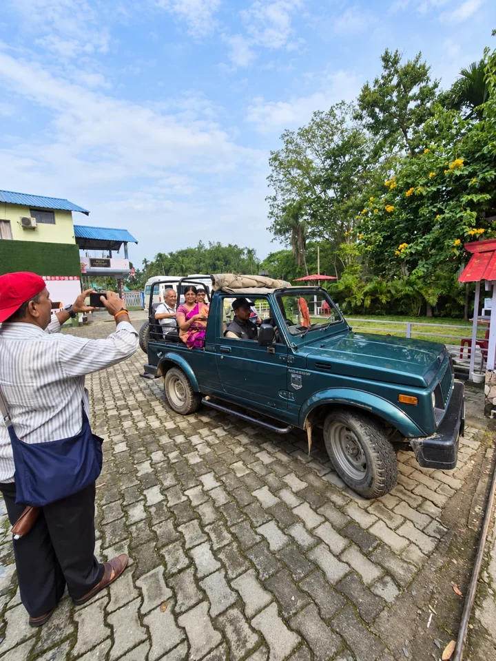Travellers taking an open-top jeep ride